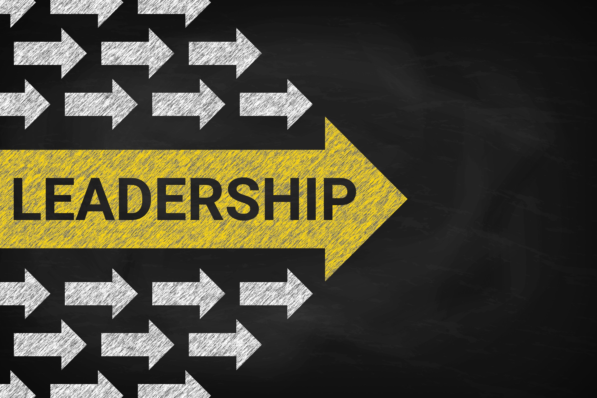 Leadership concept with arrows . Chalk on the blackboard.